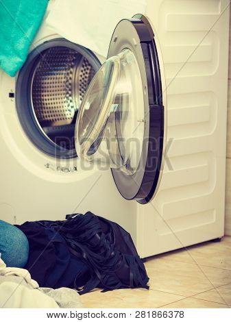 Big Pile Of Colorful Dirty Clothes For Laundry. Messy Fabric, Household Duties Objects Concept.