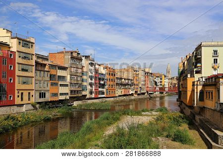 Colorful Houses And Eiffel Bridge (pont De Les Peixateries Velles) Reflected In Water River Onyar, B