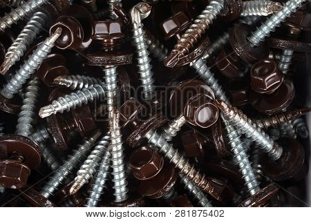 Self-tapping Screws For Fixing The Roof With Brown Hex Heads.