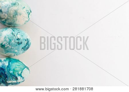 Easter Background With Easter Blue Eggs . Isolated On White. Top View With Copy Space.