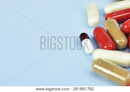 High Doses Of Medicine For Treatment. Pain Medication Tablets. Colored Pills Background. Assorted Ph