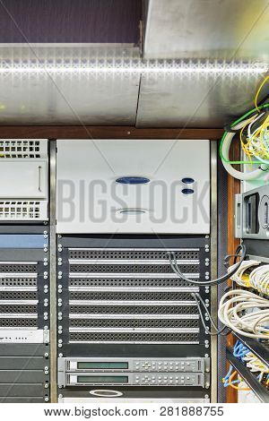 Photo Of The Wall With The Timecode Generator In The Server Rack In The Front And Video Mixer For Mi