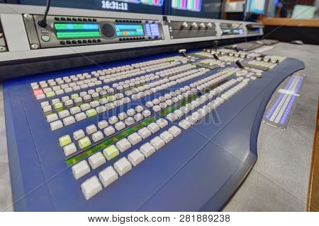 A Video Remote Control Of A Mobile Tv Station That Drives Tracks From Reporter Cameras, Imposes A Ti