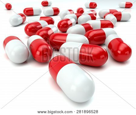 Scattered Red And White Pills On White Shiny Background With Depth Of Field