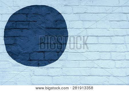 Drawn Painted Dark Blue Circle On Light Blue Brick Wall Bricks Surface Of Wall, As Graffiti. Graphic