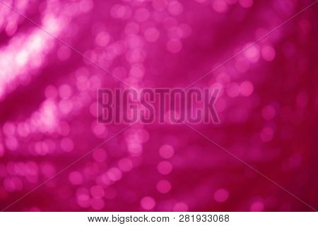 Out of focus Sequin Background. room for text. Hot Pink Sequin shallow depth of focus background.