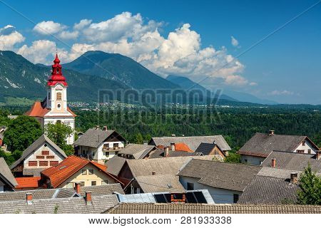 St. Janez Church And Landscape Of The Julian Alps Near Bled, Slovenia