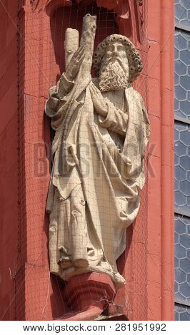 WURZBURG, GERMANY - JULY O4, 2018: Saint Andrew the Apostle statue on the portal of the Marienkapelle in Wurzburg, Bavaria, Germany