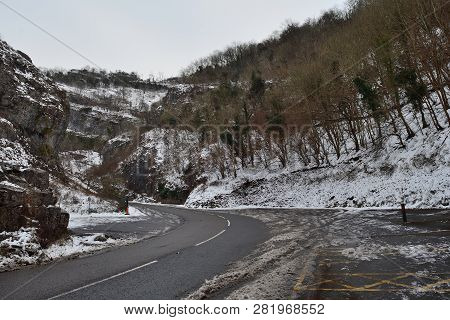 Road Running Through Cheddar Gorge On A Snowy Day