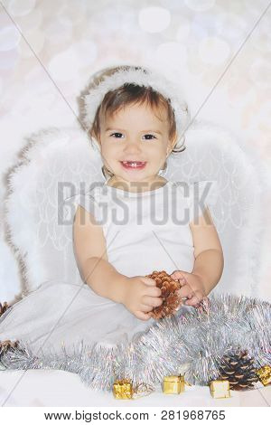 Little Child In The Costume Of An Angel. Selective Focus.