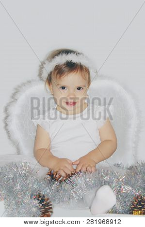 Little Child In The Costume Of An Angel. Selective Focus.