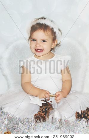 Little Child In The Costume Of An Angel. Selective Focus.