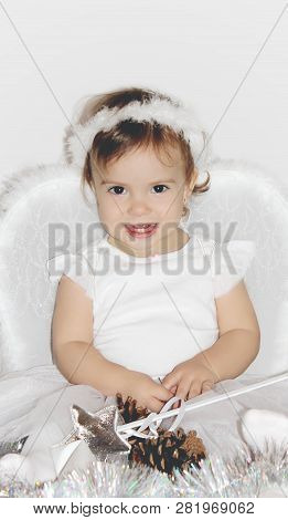 Little Child In The Costume Of An Angel. Selective Focus.