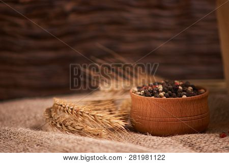 Bowl Of Various Pepper Peppercorns Seeds Mix On Table Rastic Style Background