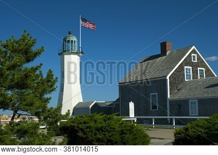Scituate Lighthouse In Massachusetts With Adjoining Keepers Quarters, Now A Museum. The Unique Tower