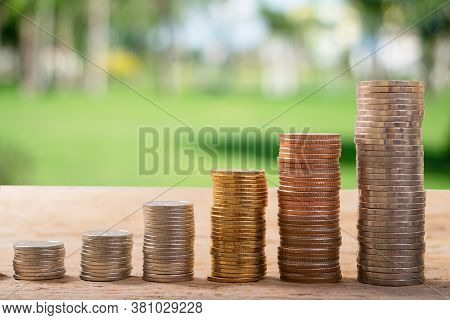 Coin Stack On Wood With Green Bokeh,  Good For Save Money Background, Or Business Growing, Stock Fun