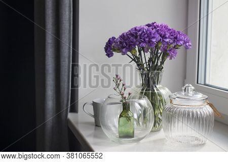 Bridal Bouquets Of Lilac Carnations In A Round Glass Vase Different Sizes As Table Decoration