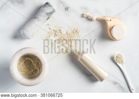 Homemade Ubtan Face Mask Preparation. Bowl With Ubtan Powder,, Bottle, Spoon With Ingredients, Clean
