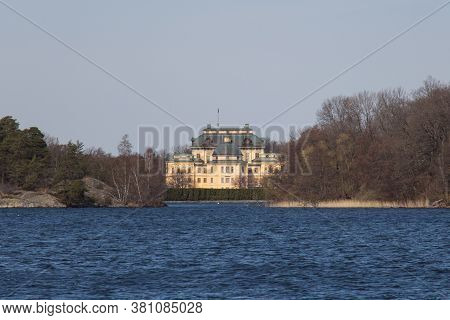 Drottningholm, Sweden - April 21 2019: The View Of Drottningholm Palace Seeing From Water On April 2