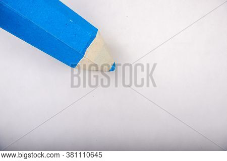 Blue Pencil Stands On A White Background