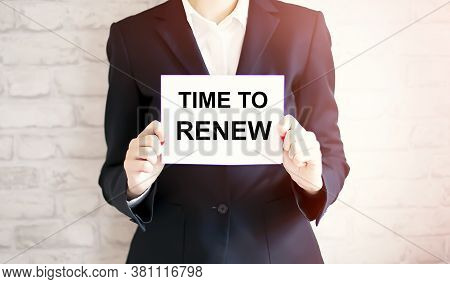 Woman Showing White Card With Time To Renew Word . Business