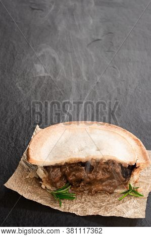 Pukka  Pie Pasty On Black Stone Background