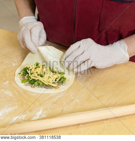 Woman Making Qutab Meal From Dough Close Up
