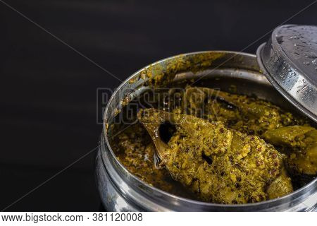 Steamed Ilish Or Hilsa Fish With Mustard Paste In A Steel Tiffin Box On Black Background