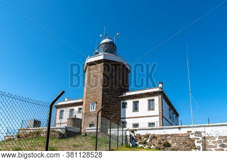 Finisterre, Spain - July 19, 2020: The Lighthouse Of Cape Of Finisterre In Costa Da Morte Or Death C