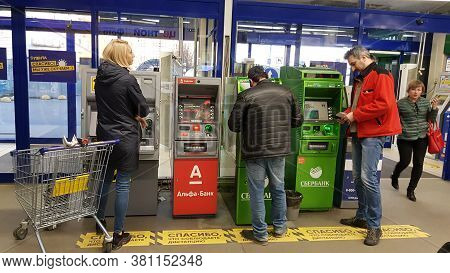 Ussia, St. Petersburg 23.04.2020 People At The Atm With Markings During The Coronavirus Epidemic