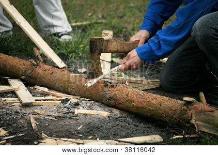 Old Axe Stuck In A Chopping Man