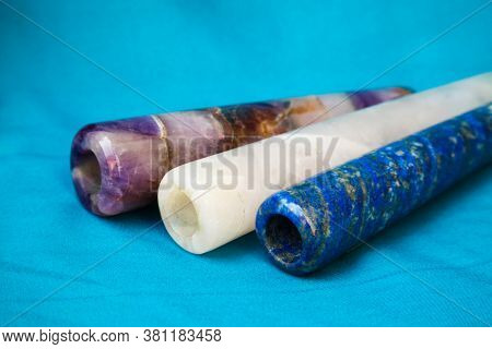 Clay Chillum For Marijuana Smoking On A Blue Fabric Background