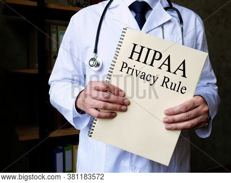 The Doctor Shows Hipaa Privacy Rule In His Office.