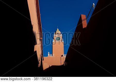 Red Clock Tower Of The Olimpo Cultural Center On Cloudless Blue Sky In The Colonial City Of Merida, 