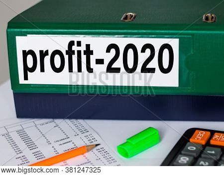 Many Papers Orderly Arranged In A File Shelves. And Some Are Still On The Table. Businessman Documen
