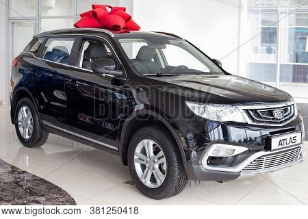 Russia, Izhevsk - August 14, 2020: New Modern Atlas Car In The Geely Showroom. Front And Side View.