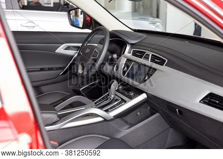 Russia, Izhevsk - August 14, 2020: Geely Showroom. Interior Of New Modern Car Geely Atlas With Autom
