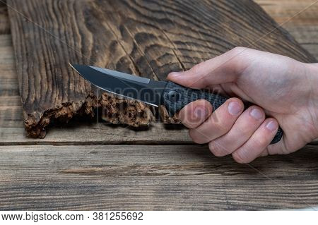 Knife Clamped In Hand. Hit With A Knife. Stab With A Knife. Front View.