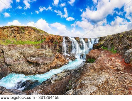 Amazing Kolufossar Waterfall At Summer Sunny Day.  Popular Tourist Travel Destination In Iceland . L