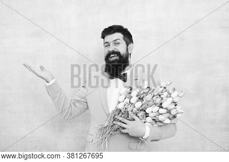 Flower Bouquet For Womens Day. Bearded Man With Tulips. Flowers Shop. Ideas To Celebrate Without Bre