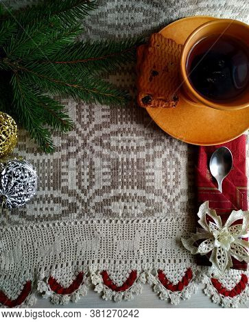 Christmas Tea On Linen Tablecloth In The Shaffron Colored Cup.