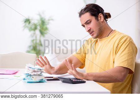 Young man in budget planning concept