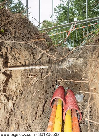 Building Of Lines Of Metallic, Fiber Optic Cables In Residential Area. Fitting, Ground.