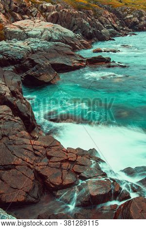 Rocky Sea Shore, Cliffs With Surf On The Gamova Peninsula In The Primorsky Territory, Seascape Of Ru