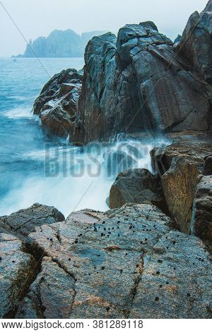 Rocky Sea Shore, Cliffs With Surf On The Gamova Peninsula In The Primorsky Territory, Seascape Of Ru