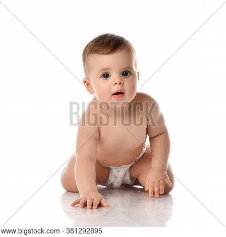 Interested Curious Infant Baby Toddler Naked In Diaper Is Crawling Toward Us On All Fours Moving Goi