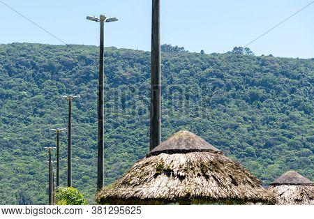 View Of A Kiosk Thatched Roof And Profiled Public Streetlights In Public Areas In The City Of Osorio