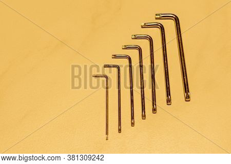 Set Of Torx Wrenches On Yellow Background