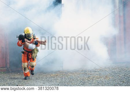 The Firefighter Was Helping The Girl. Leave The Burning And Smoky Building.