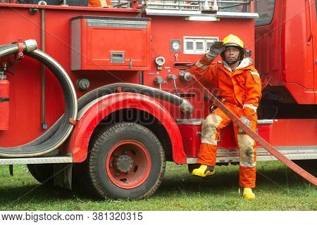 The Fireman Is Preparing To Put Out The Fire At The Fire Engine. Because The Fire Was Burning In The